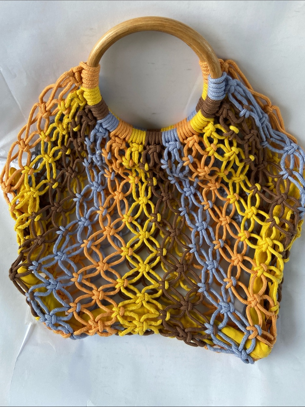 Knitted handbag measures 10x14”, wooden handle